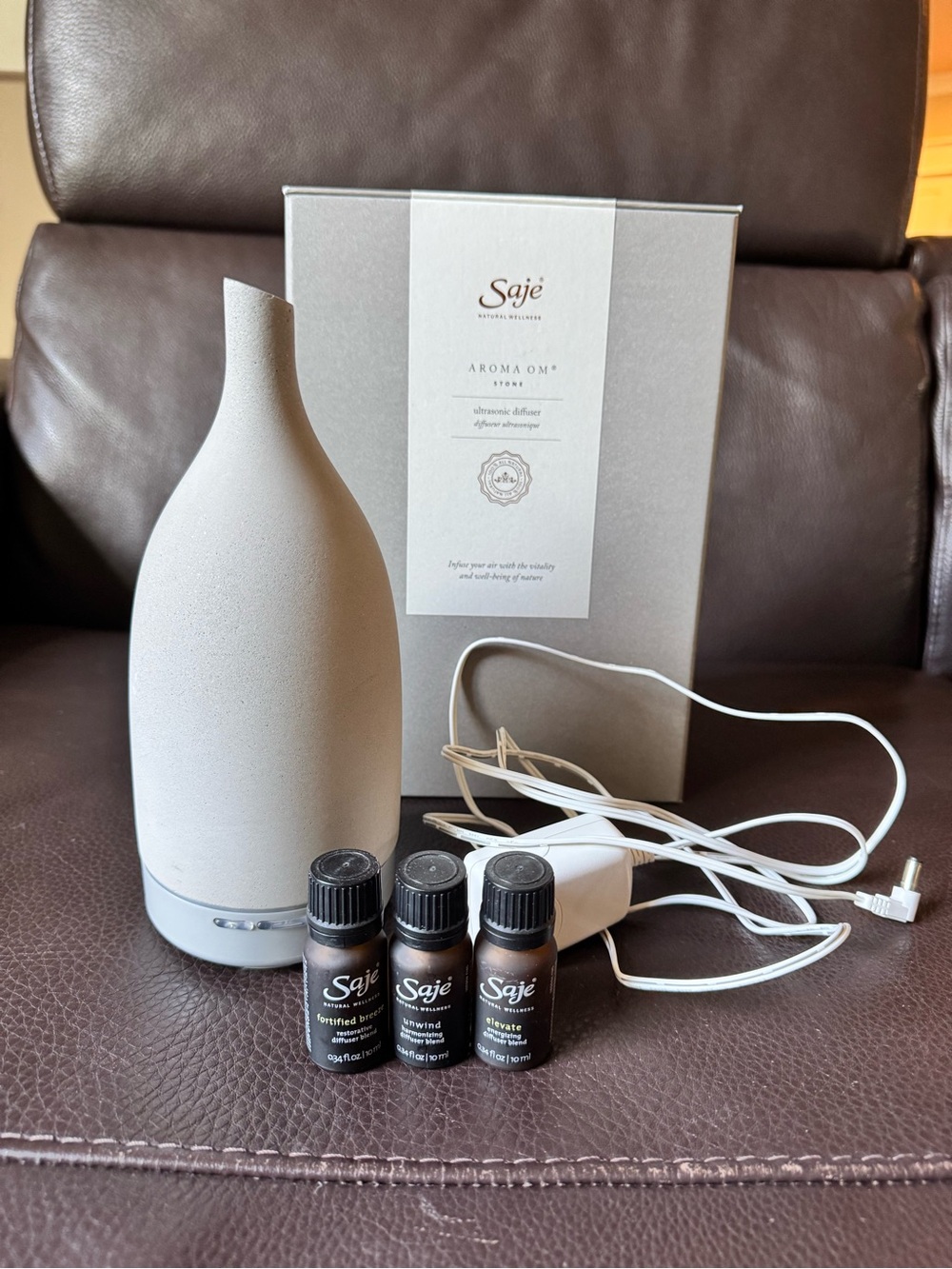 Saje Aroma Stone Diffuser ( stone) with Essential Oil set - near new